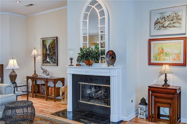 interior space featuring crown molding and hardwood / wood-style floors