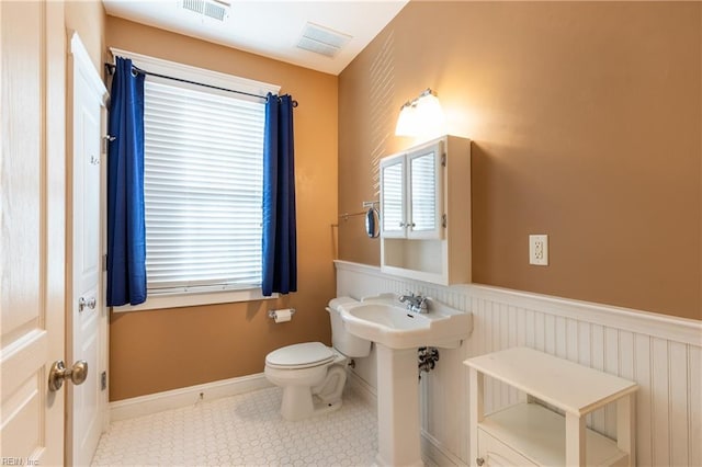 bathroom with tile patterned floors and toilet