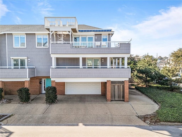 view of front of house with a garage and a balcony