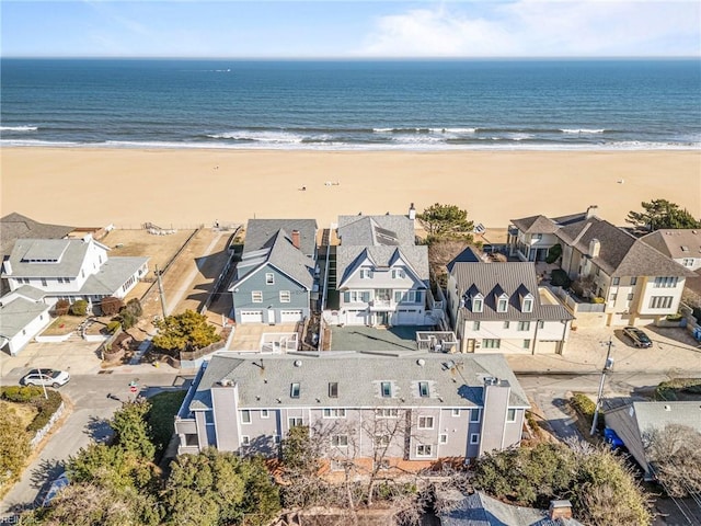 aerial view with a water view and a view of the beach