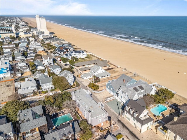 drone / aerial view with a view of the beach and a water view