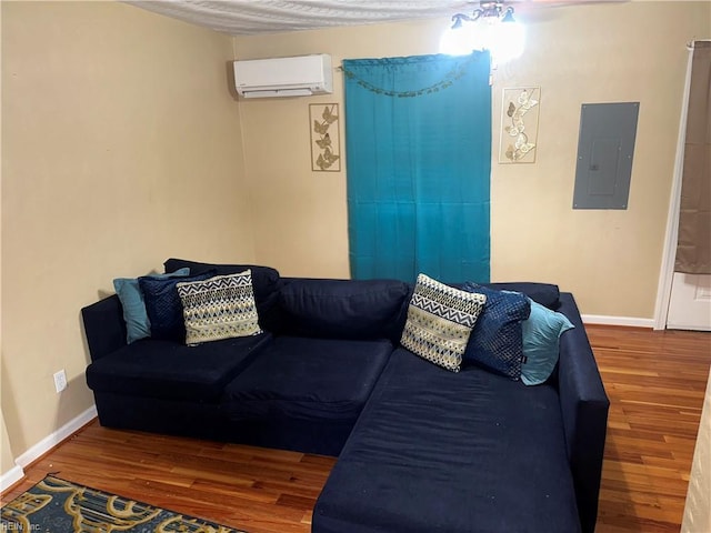 living room featuring a wall mounted air conditioner, hardwood / wood-style flooring, and electric panel