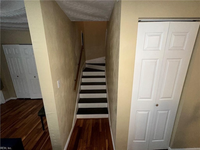 stairway with wood-type flooring