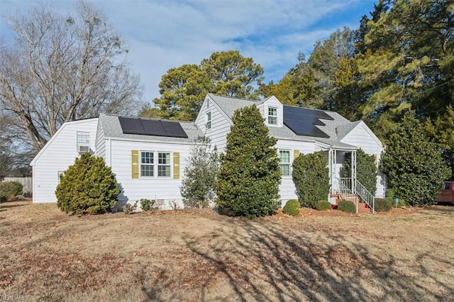 exterior space with a yard and solar panels