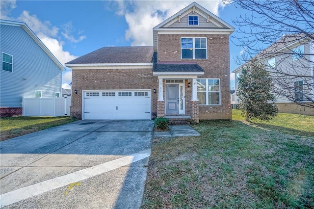 view of front of house with a garage and a front lawn