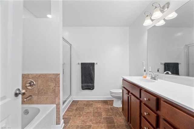 bathroom featuring vanity, a tub, and toilet