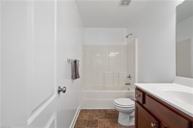 full bathroom featuring shower / tub combination, vanity, toilet, and tile patterned floors