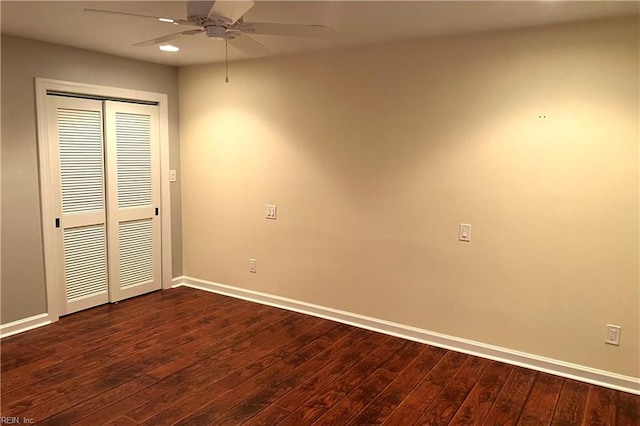 unfurnished bedroom featuring dark hardwood / wood-style floors and ceiling fan