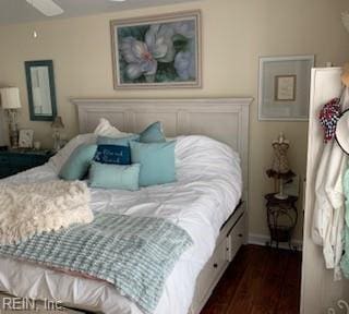 bedroom featuring dark wood-type flooring and ceiling fan