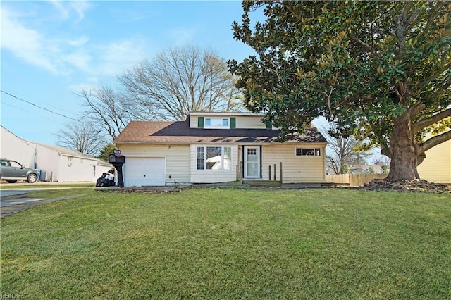 view of front of home with a garage and a front yard