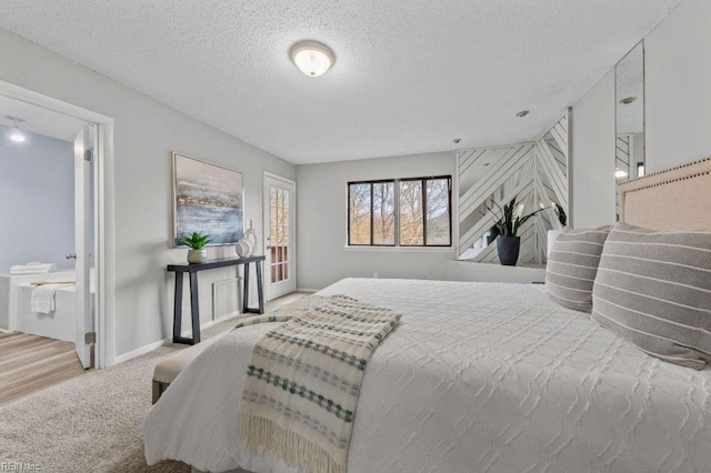 carpeted bedroom with a textured ceiling