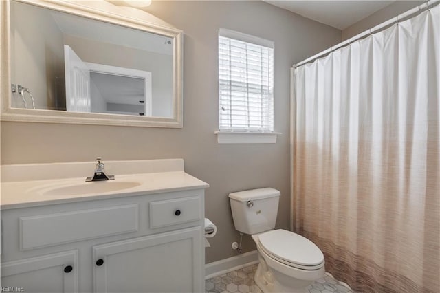 bathroom featuring vanity and toilet