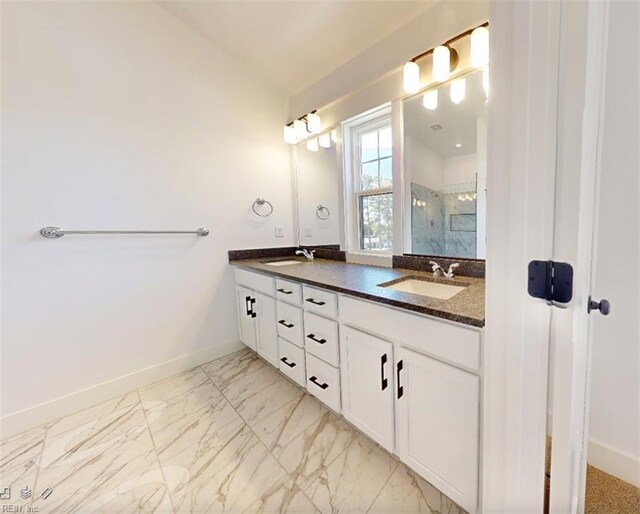 bathroom with vanity, a shower with shower door, and lofted ceiling