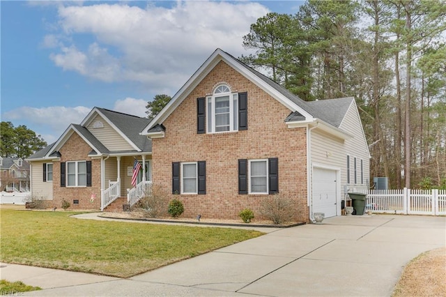 view of front of house featuring a garage and a front yard