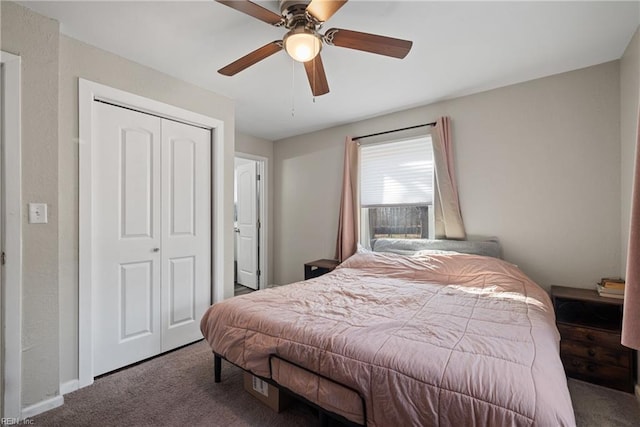 carpeted bedroom featuring a closet and ceiling fan