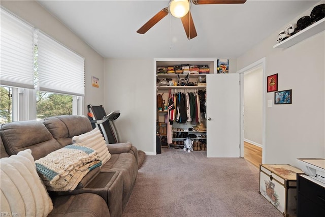 interior space featuring carpet flooring and ceiling fan