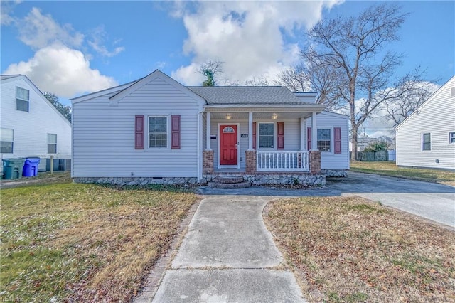 view of front of property with a front yard and a porch