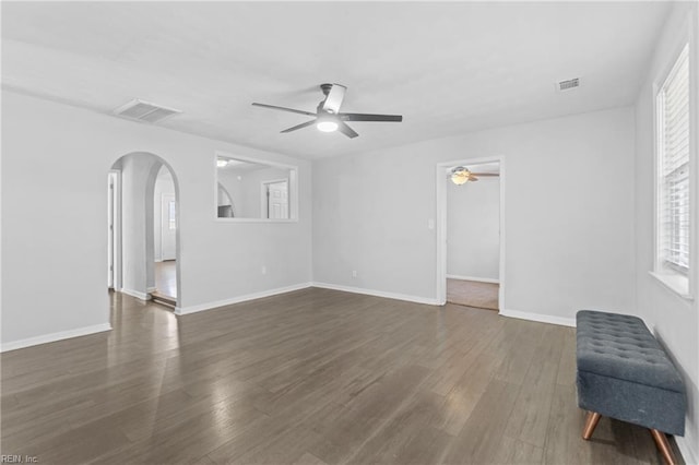 interior space with ceiling fan, radiator heating unit, and dark hardwood / wood-style floors