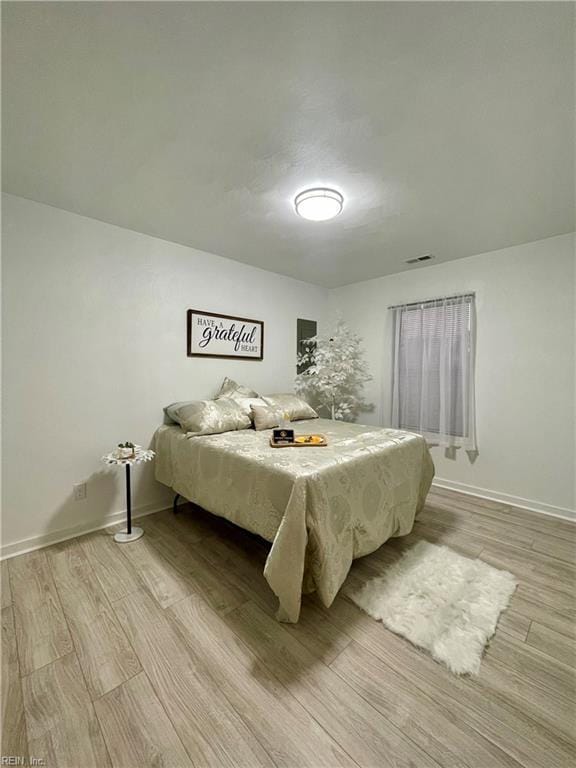 bedroom with light hardwood / wood-style flooring