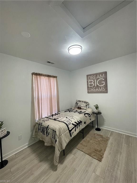 bedroom with light hardwood / wood-style flooring