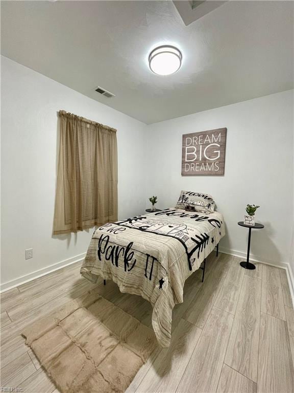 bedroom featuring hardwood / wood-style flooring