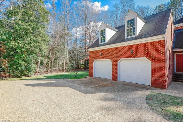 view of side of property with a garage