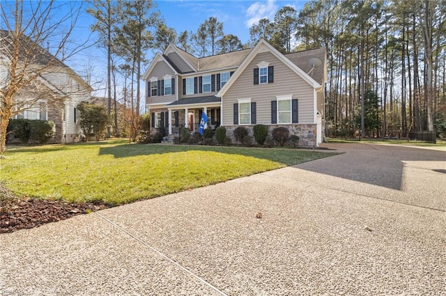 view of front of home with a front yard and a porch