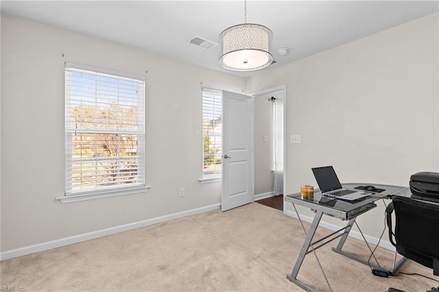 carpeted home office featuring a healthy amount of sunlight