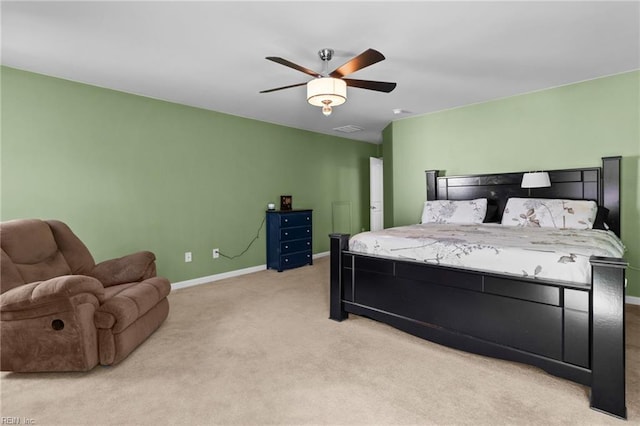 bedroom featuring light colored carpet and ceiling fan