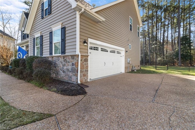 view of side of home featuring a garage