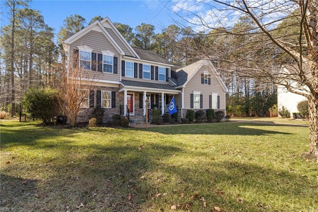 view of front of house featuring a front yard and covered porch