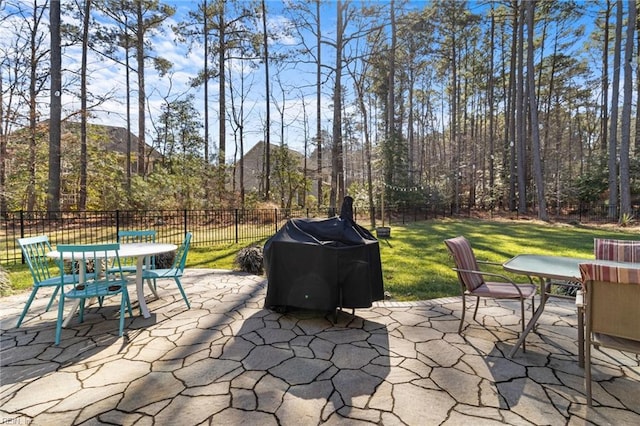 view of patio with area for grilling and a mountain view