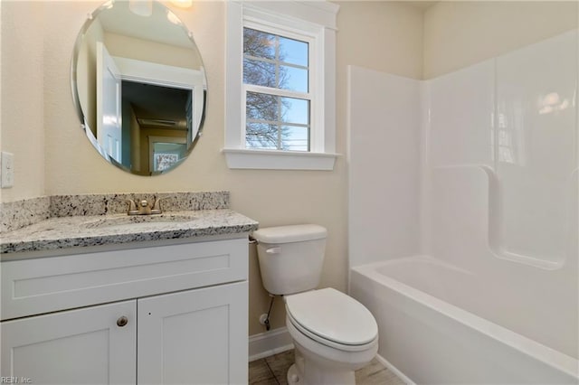 full bathroom with washtub / shower combination, vanity, and toilet