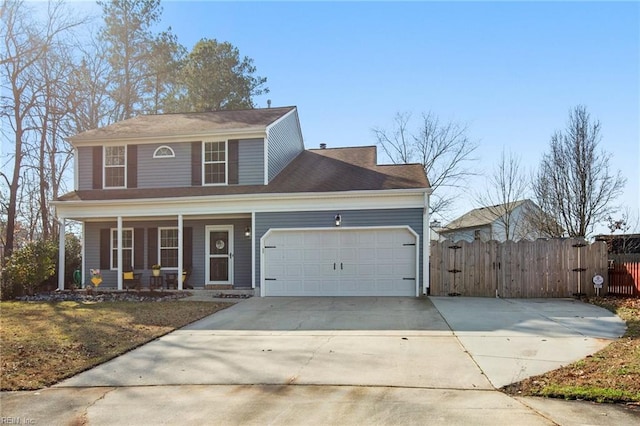 view of front of property with a porch and a garage