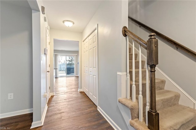 corridor featuring dark wood-type flooring