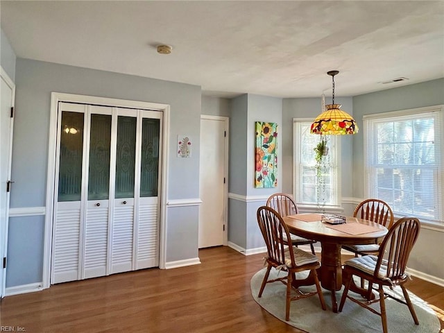 dining room with dark hardwood / wood-style floors