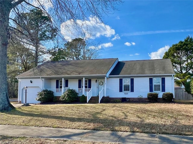 single story home with a garage and a front lawn