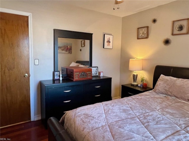 bedroom featuring dark hardwood / wood-style flooring