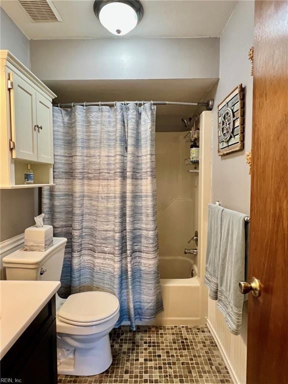 full bathroom featuring vanity, toilet, and shower / tub combo with curtain