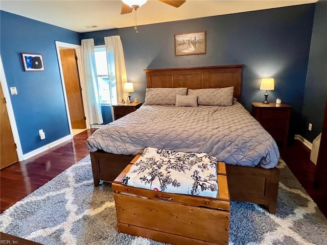 bedroom with dark wood-type flooring and ceiling fan