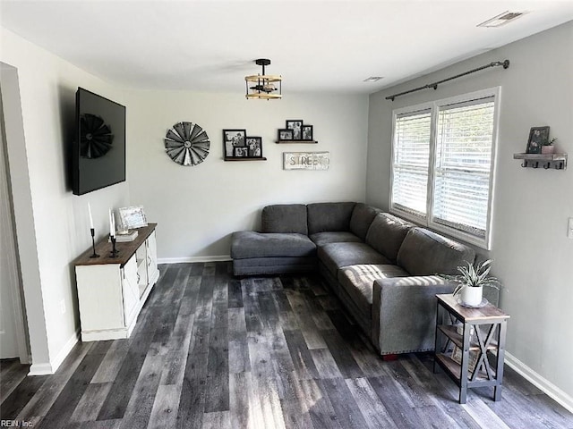 living room featuring dark wood-type flooring