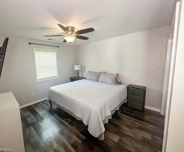 bedroom with dark wood-type flooring and ceiling fan