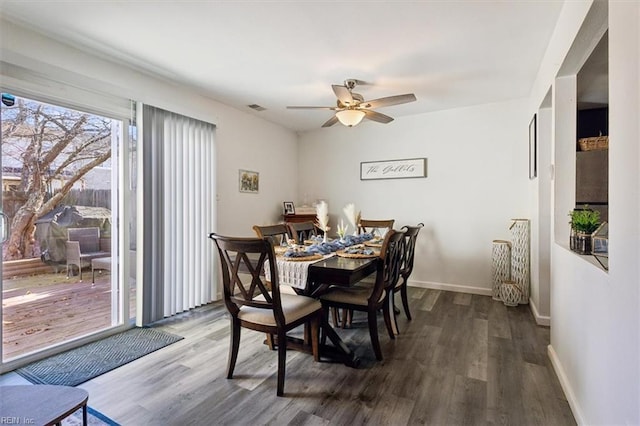 dining space with wood-type flooring and ceiling fan