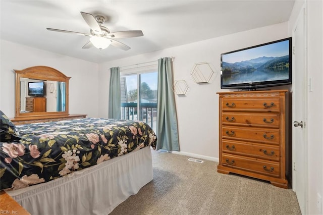 carpeted bedroom featuring access to exterior and ceiling fan