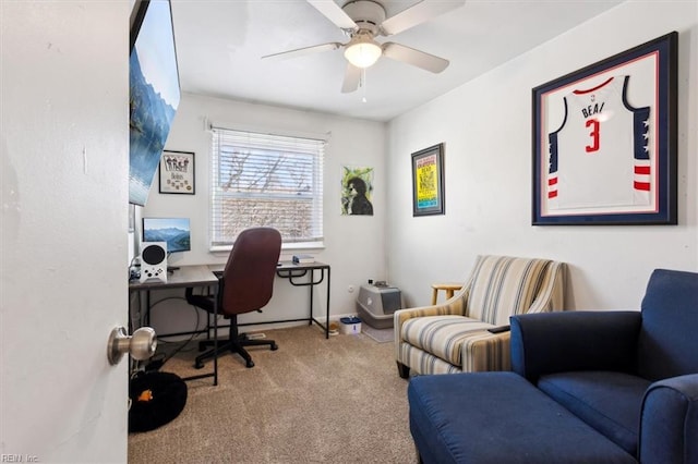 carpeted home office with ceiling fan