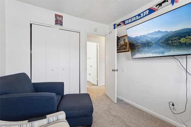 living area with light colored carpet