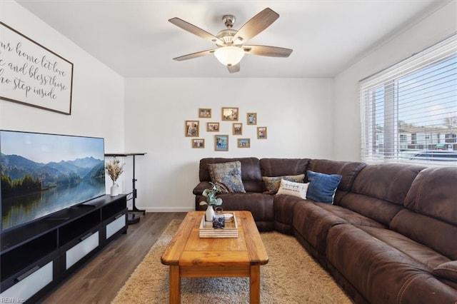 living room featuring dark hardwood / wood-style floors and ceiling fan