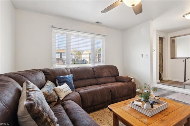 living room with hardwood / wood-style floors and ceiling fan