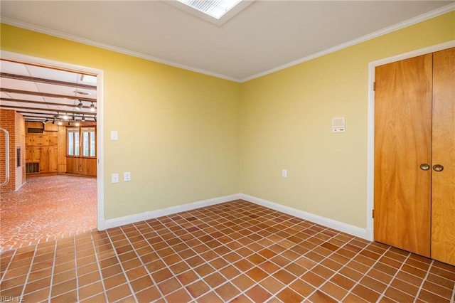 unfurnished room with ornamental molding