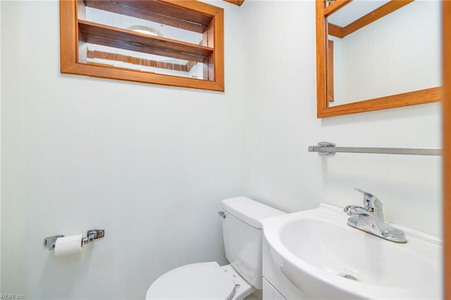 bathroom with sink and toilet